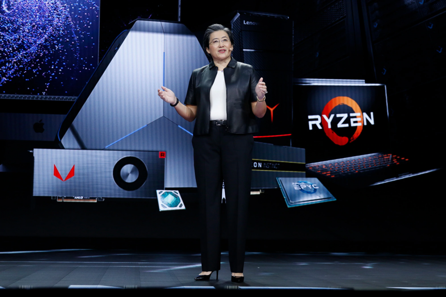 Picture of Lisa Su, the CEO of AMD standing on a stage in black outfit