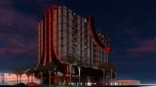 A picture of big red-white video-game themed hotel, proposed by Atari