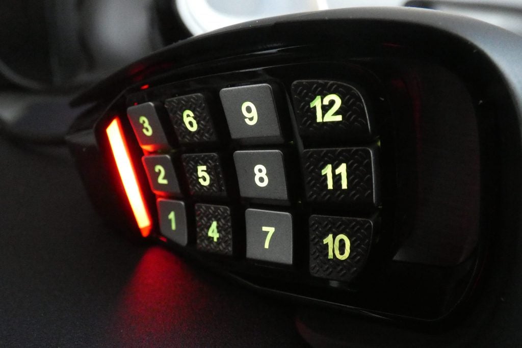 Close up image of number buttons on side panel of a black Corsair RGB Elite mouse