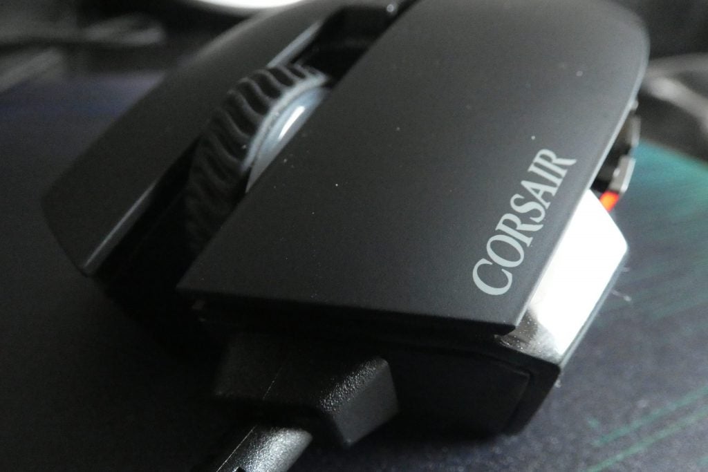 Front view of a black Corsair RGB Elite mouse kept on a table