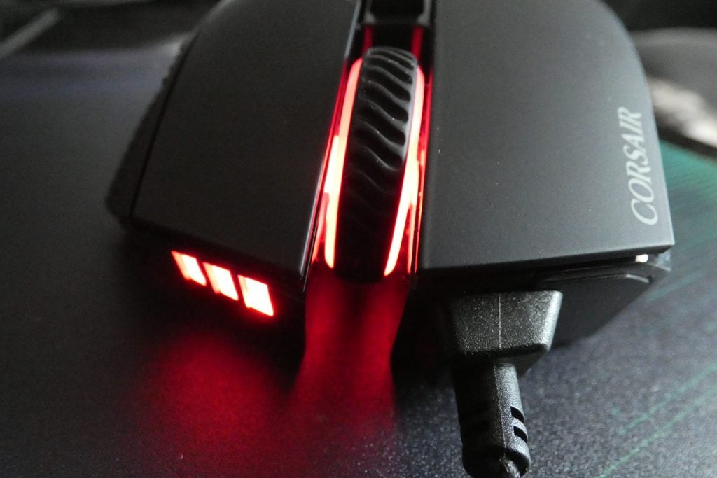 Front view of a black Corsair RGB Elite mouse kept on a table
