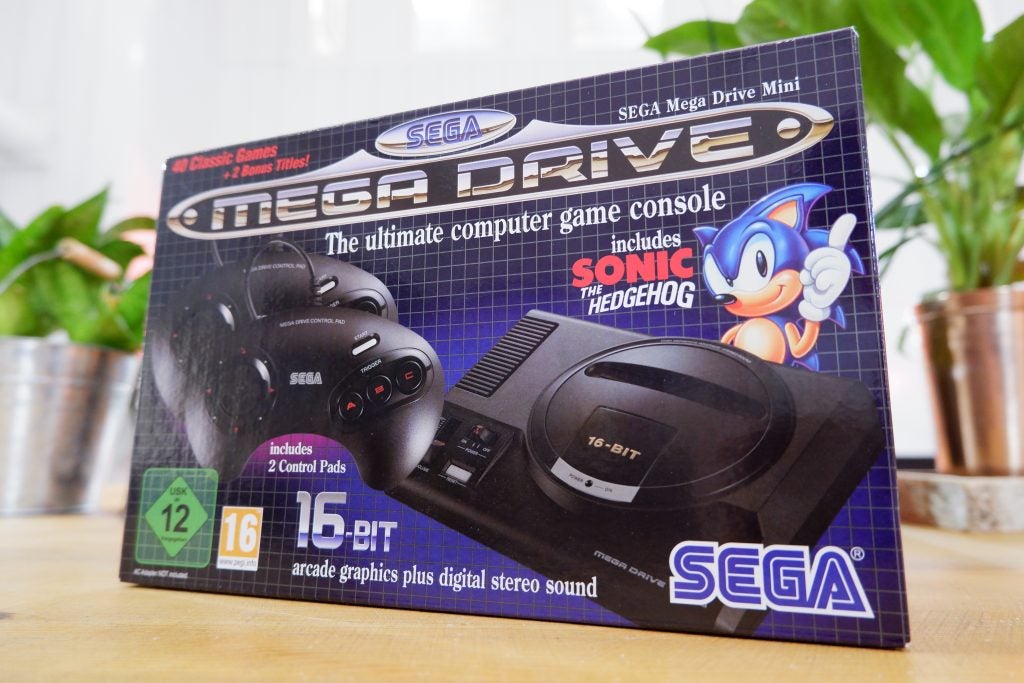 Front side view of packaging box of Sega Mega Drive Mini kept on a table