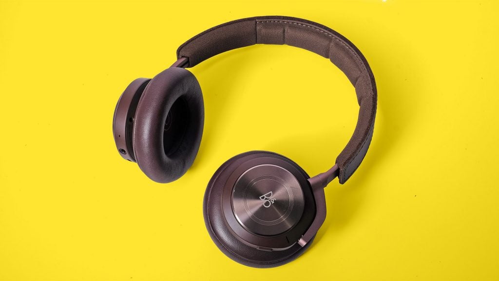 Beoplay H9 3rd GenView from top of black B&O headphones kept on a yellow background