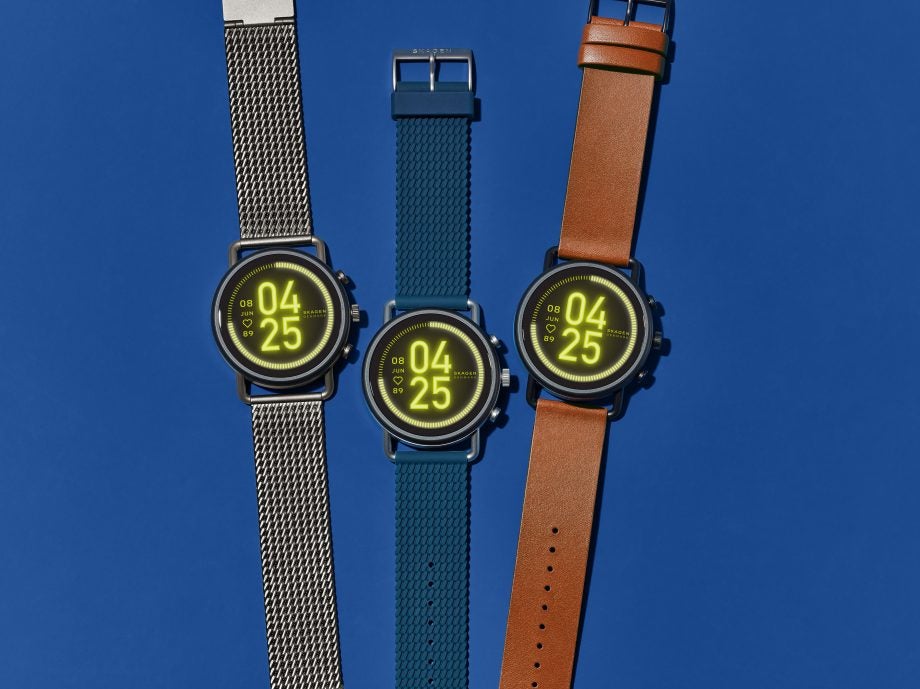 Three different colored Fossil's Skagen Falster 3 watch kept on a blue background
