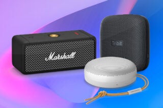 A black Marshall speaker, a black Tribit speaker and a white BO speaker standing on a blue background