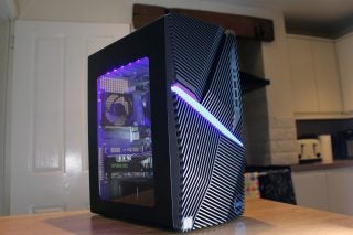 A black Dell G5 gaming desktop standing on a table