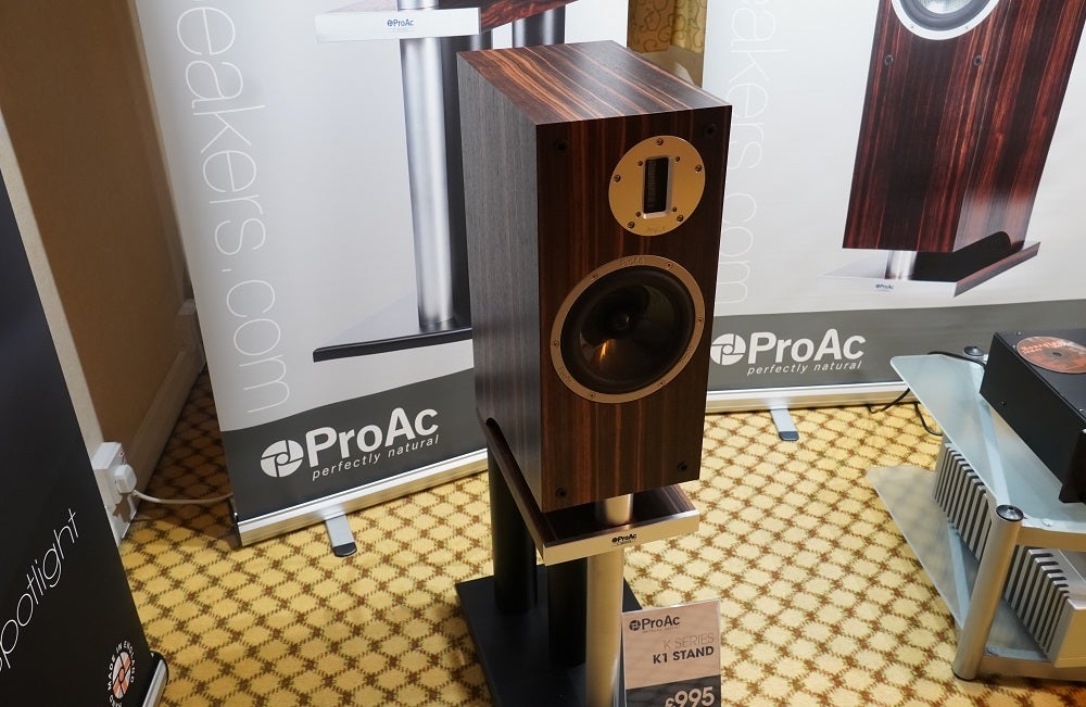 A brown PRoAC K1 speaker standing on a stand