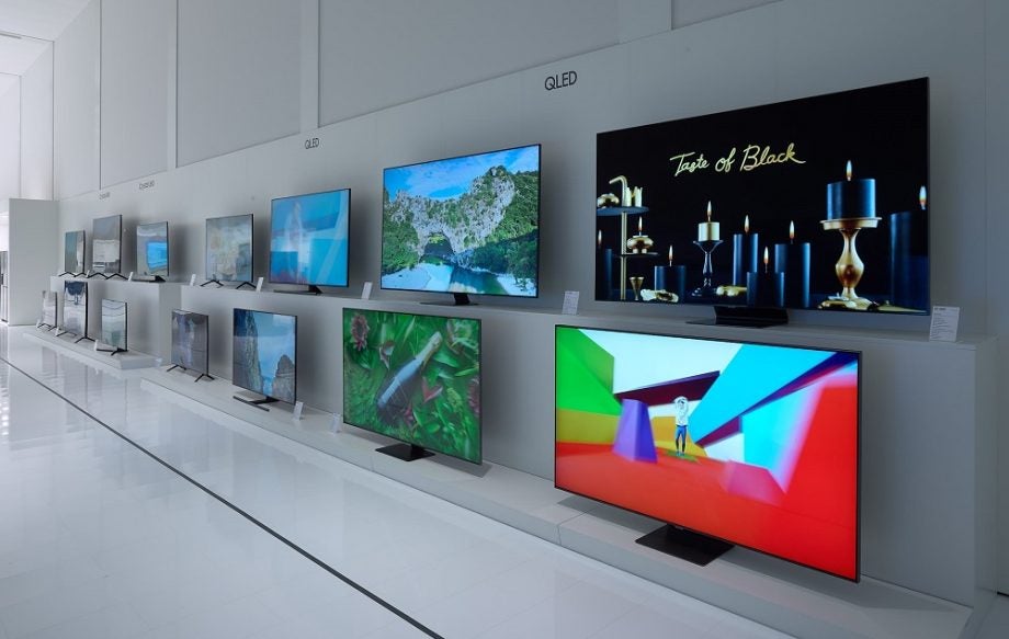 Picture of a Samsung QLED line up in a Samsung store