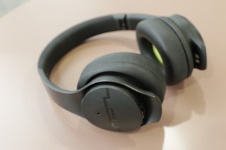 Side view of black SOL Republic Soundtrack Pro headphones kept on a table