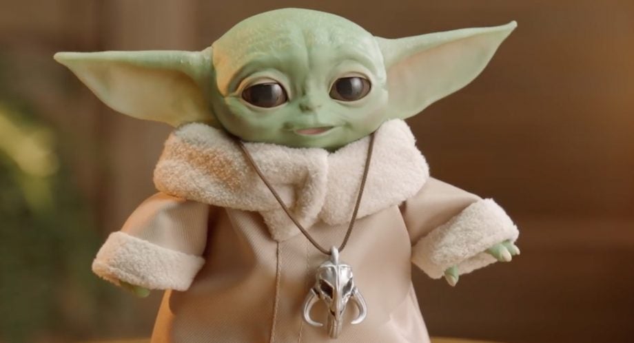 Close up image of a small standing toy of Baby Yoda