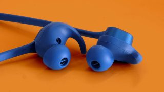 Close up image of blue Bowers & Wilkins PI3 wireless earphone's earpieces