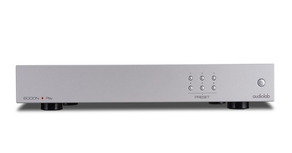 A silver Audiolab 6000N Play standing on white background
