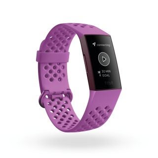 A purple colored Fitbit charge 4 standing on white background displaying 30 min goal