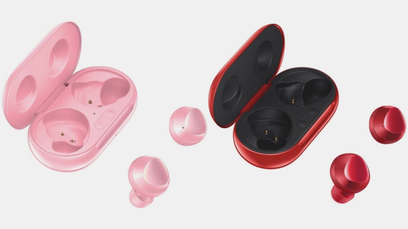 Two different colored Galaxy Buds Plus kept beside their case on white background