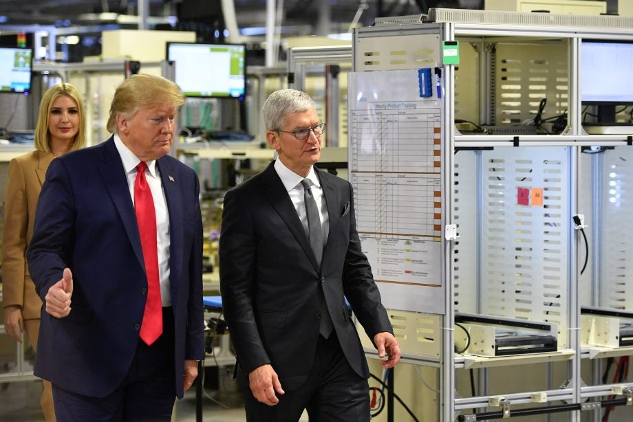 Picture of Donald Trump walking with Tim Cook