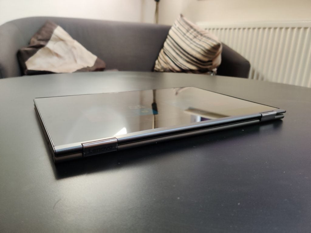 Lenovo Yoga C630 4GA Lenovo Yoga C630 folded backwards into a tablet kept on a table