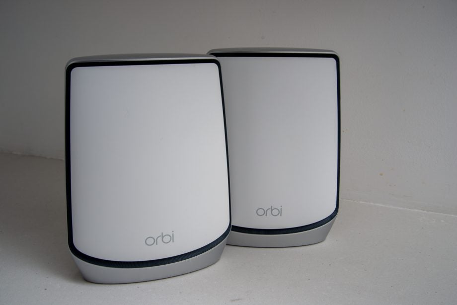 Netgear Orbi Wi-Fi 6, Mesh Wi-Fi system kept on a white background