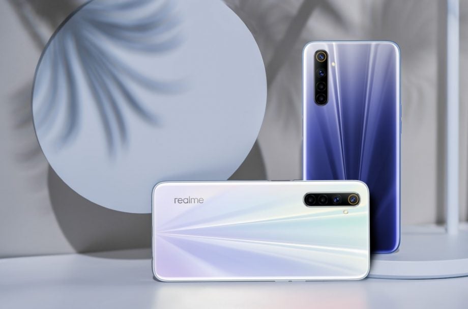 A blue and a white Realme 6 standing facing back, back panel view