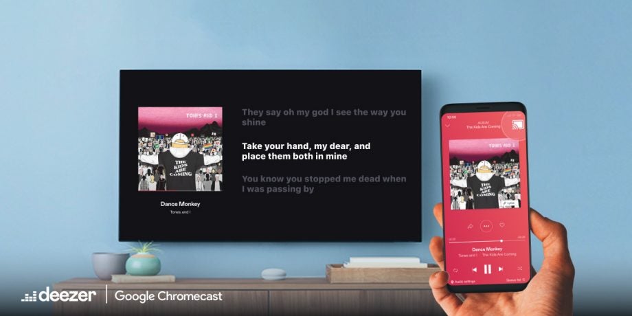 A TV displaying lyrics on Google Chromecast from Deezer playing music on smartphone