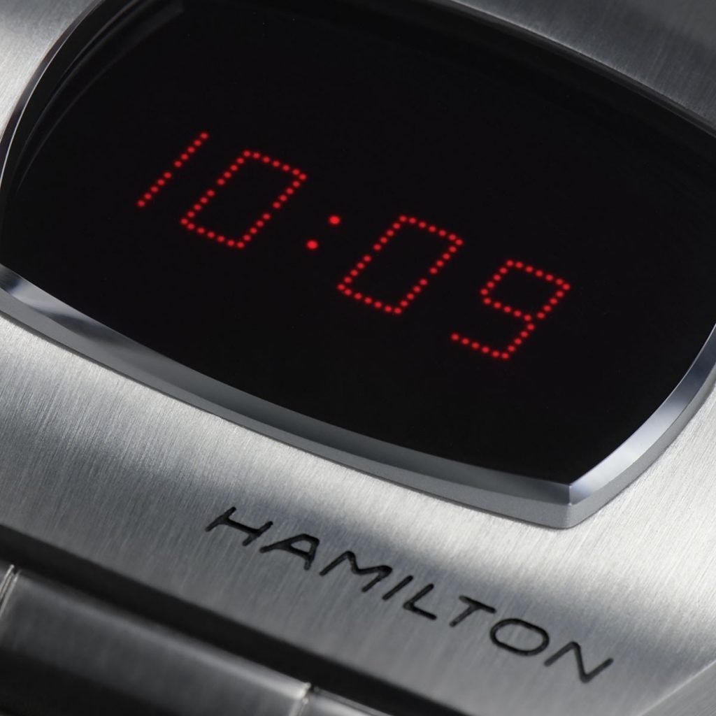 Close up image of a silver Hamilton watch displaying time 