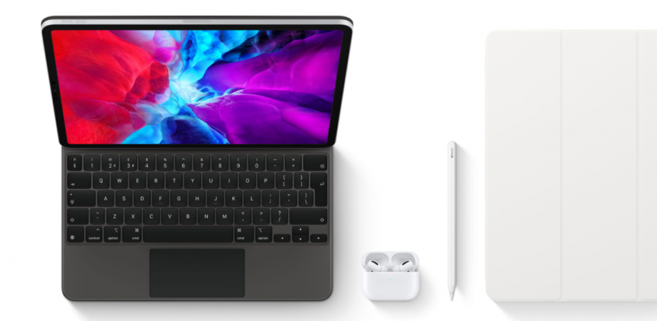 An iPad Pro 2020 standing on white background beside it's pencil and AirPods, another iPad Pro laid showing  closed state