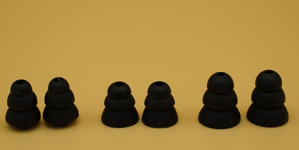 Close up image of black Audiofly AF100 MK2 earphone's earpiece covers kept on a table