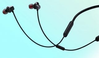 Black wireless earphones floating on a cyan background