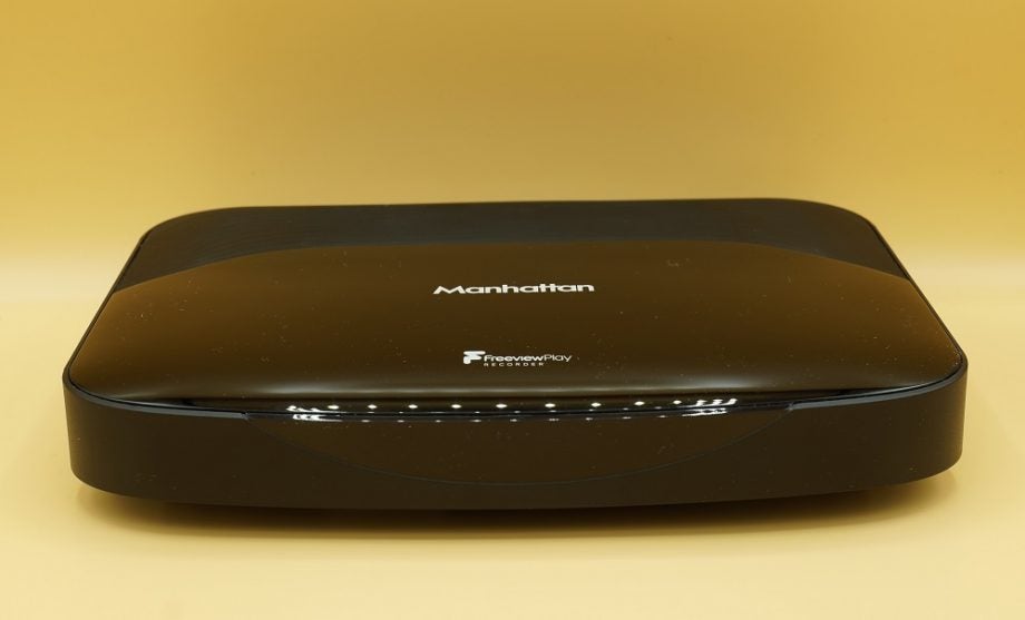 A black Manhattan T3 Freeview Play box kept on a table