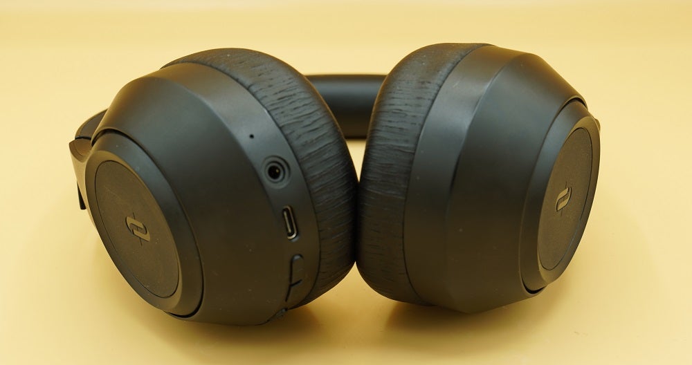 Close up image of black TaoTronics Soundsurge 55 headphone's earcups