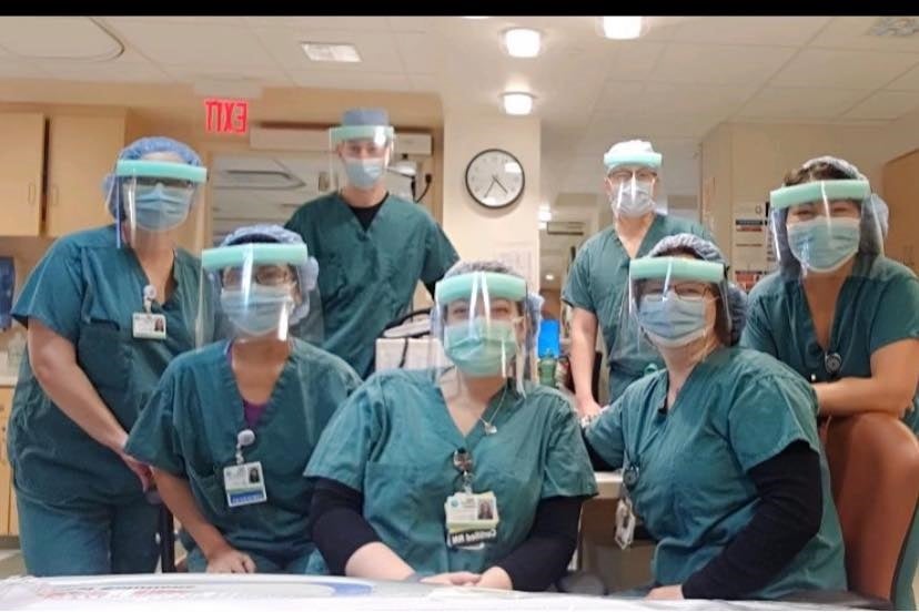 A picture of group of doctors and nurses wearing VPI face mask