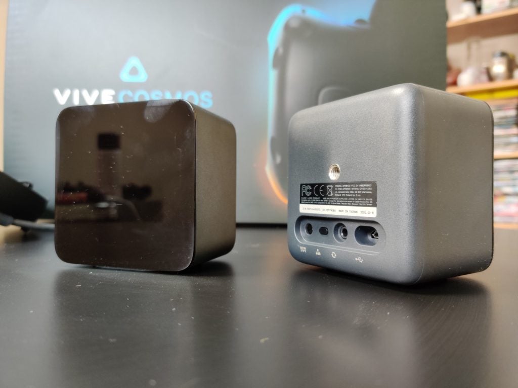 Picture of black Vive Cosmos Elite VR base stations kept on a black table