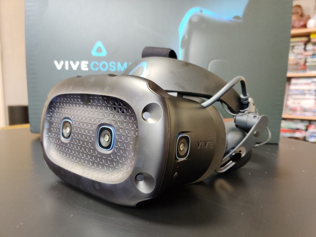 Side view of a black Vive Cosmos Elite VR kept on a black table