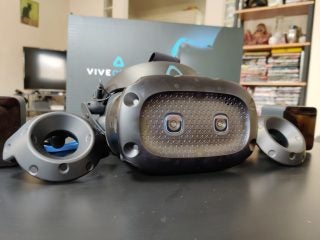 A black Vive Cosmos Elite VR kept on a black table