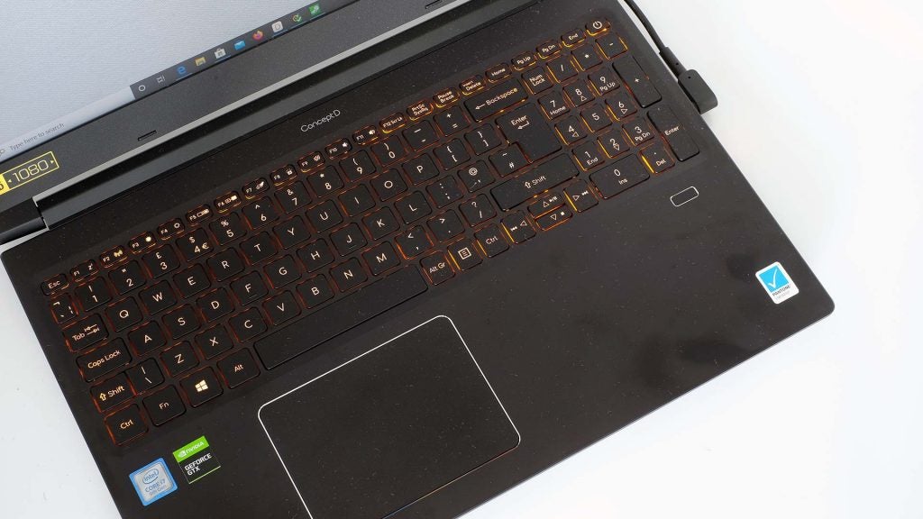 Close up image of a black ConceptD laptop's keyboard section with touchpad, view from top