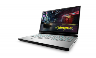A silver-black Alienware laptop standing on white background displaying wallpaper of Cyberpunk 2077