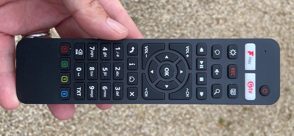 Cello C43FVP's black remote held in hand 