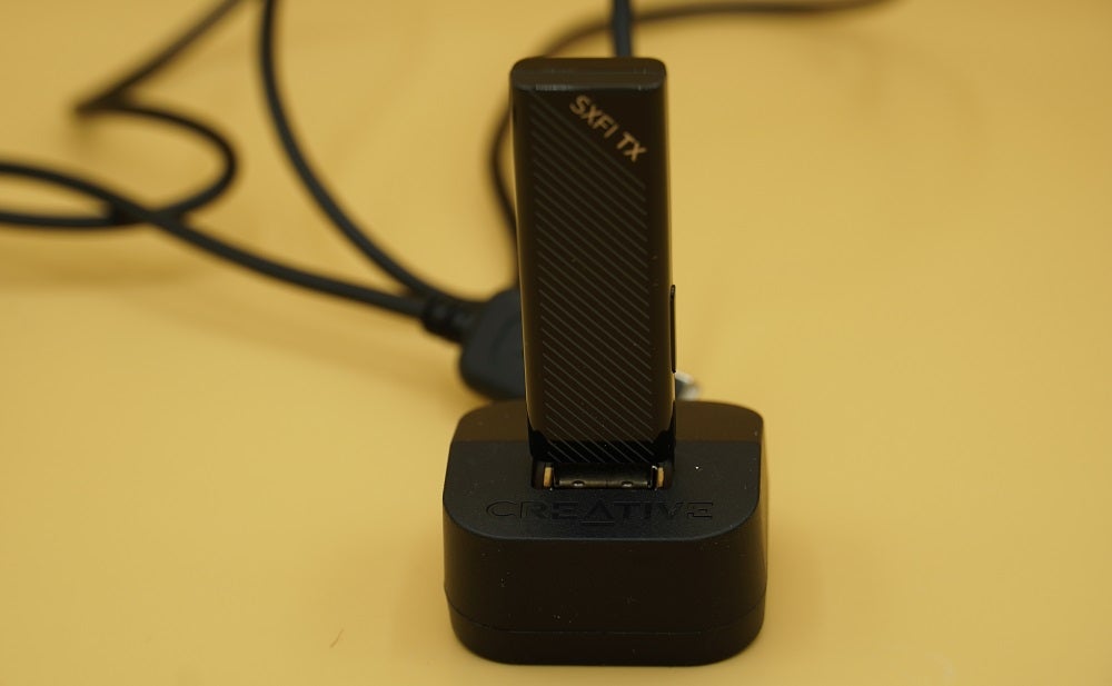 A black USB of Creative SXFI theater headphones attached to a black creative box