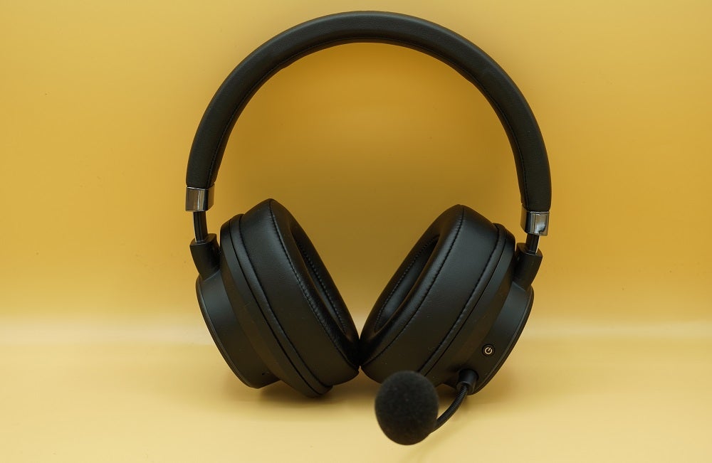 Creative SXFI Theater with detachable micBlack Creative SXFI theater headphones standing on a yellow background