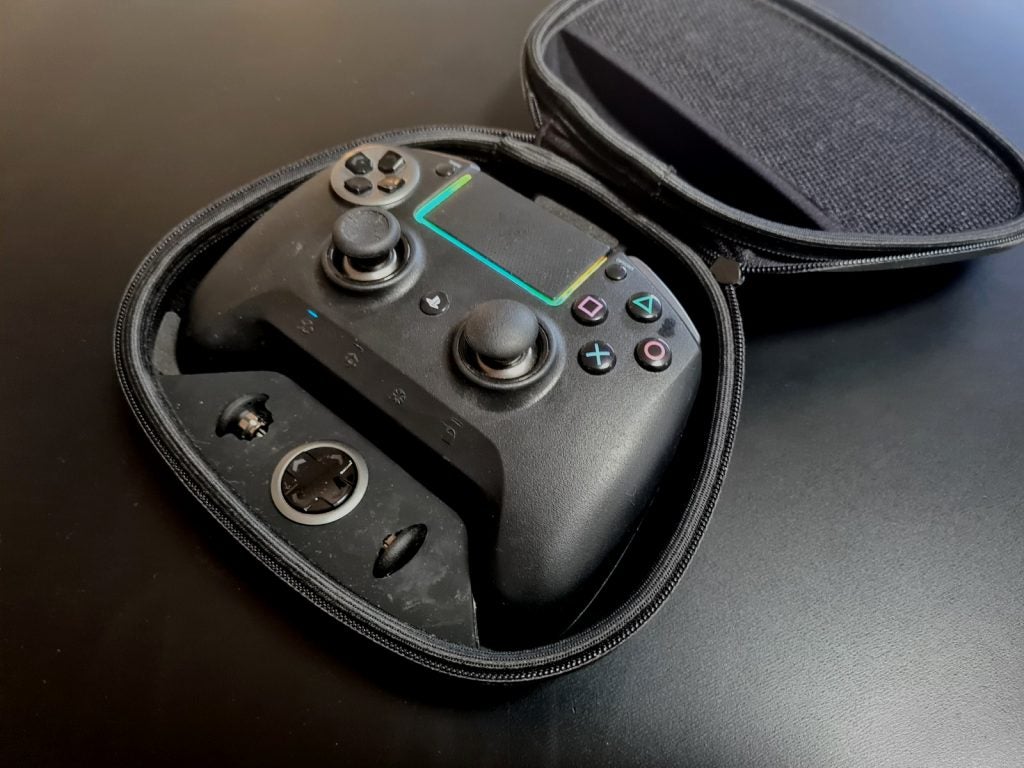 A black Razer Raiju Ultimate gaming controller resting in it's black case