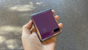 A Samsung Z flip held in hand in folded state