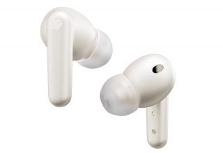 White Urbanista London earbuds floating on a white background