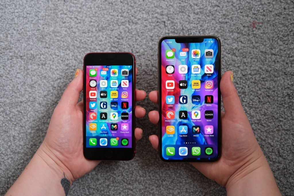 iphone SE 2 and iPhone 11 Pro Max being held next to each other 