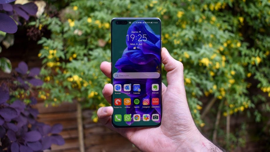 A Huawei P40 Pro Plus held in hand displaying homescreen