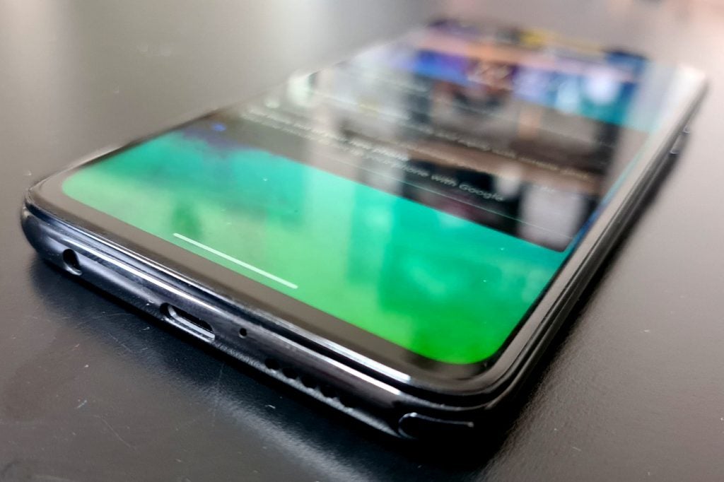 Bottom edge view of a black Motorola G Pro laid on a table