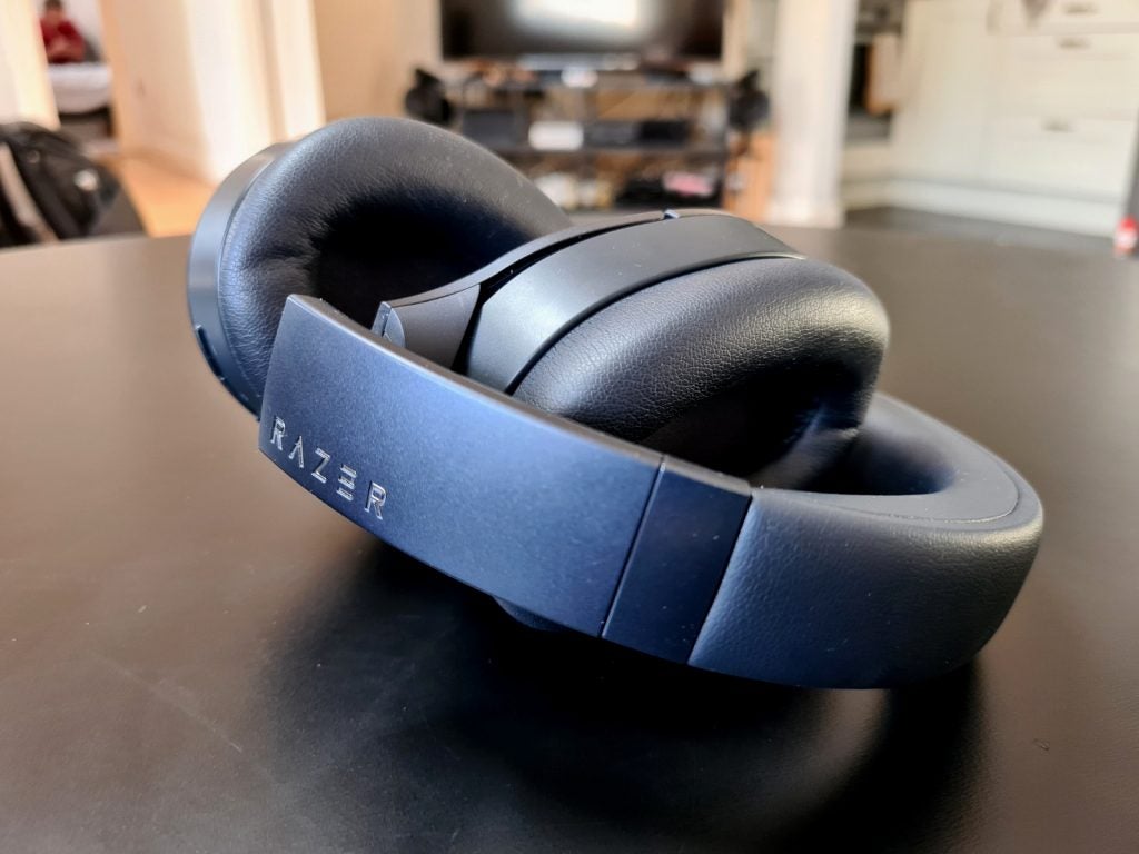 Razer OpusSide view of black Razer Opus headphones kept on a table