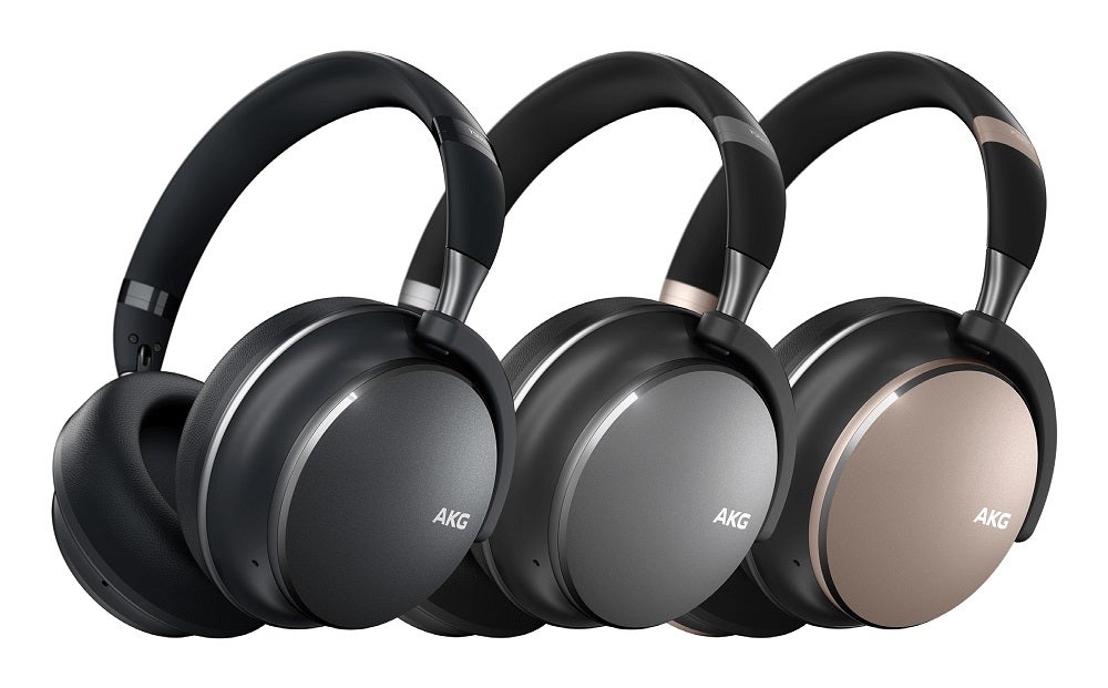 Three different colored AKG Y600NC wireless headphones standing on white background