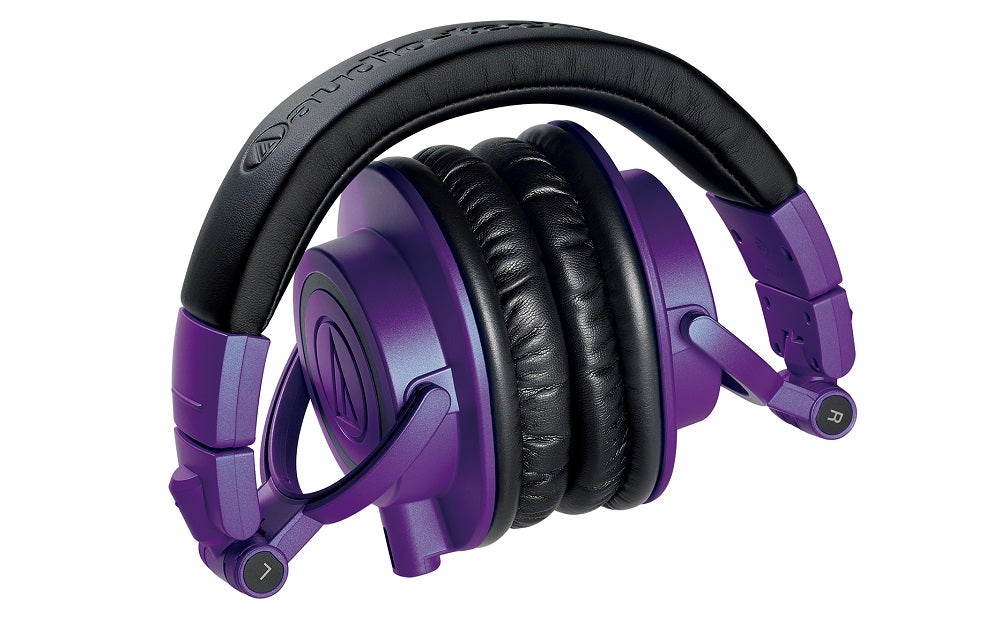 Violet-black Audio Technica ATH M50xPB headphones floating on white background