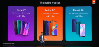 A man standing on a stage pointing towards Redmi 9 series phones dispalyed on the screen behind