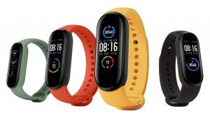 Four different colored Xiaomi Mi band 5 flaoting on a white background