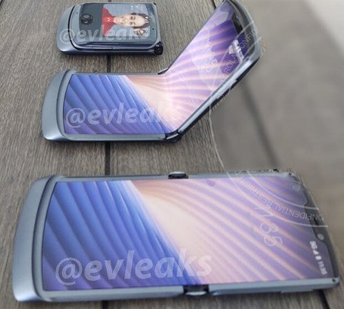 Three Motorola Razr smartphones resting on a table, showing different states of folding